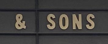 Sign at And Sons menswear shop on Poland Street in London