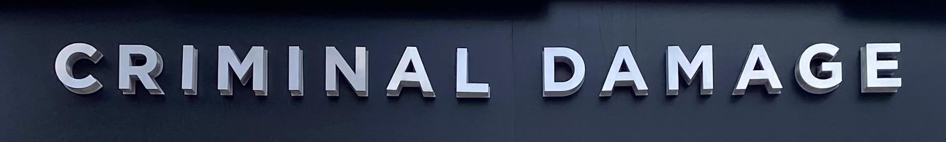 Sign at Criminal Damage shop on Camden High Street, London