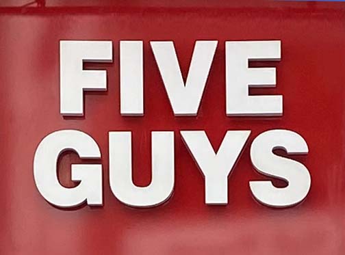 Sign at Five Guys restaurant at end of Long Acre in Covent Garden