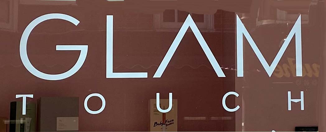 Sign at Glam Touch shop on Greek Street in London