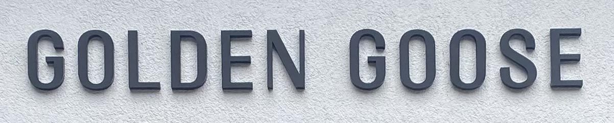 Sign at Golden Goose fashion shop on Draycott Avenue at Brompton Cross in London