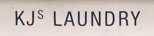 Sign at KJ's Laundry shop on Marylebone Lane