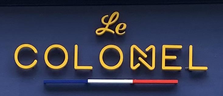 Le Colonel shop sign on Brick Lane in London