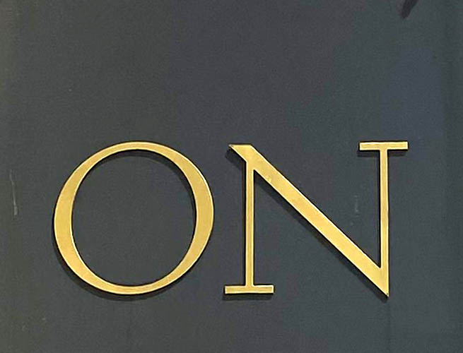 Sign at On Motcomb womenswear shop on Motcomb Street in Knightsbridge