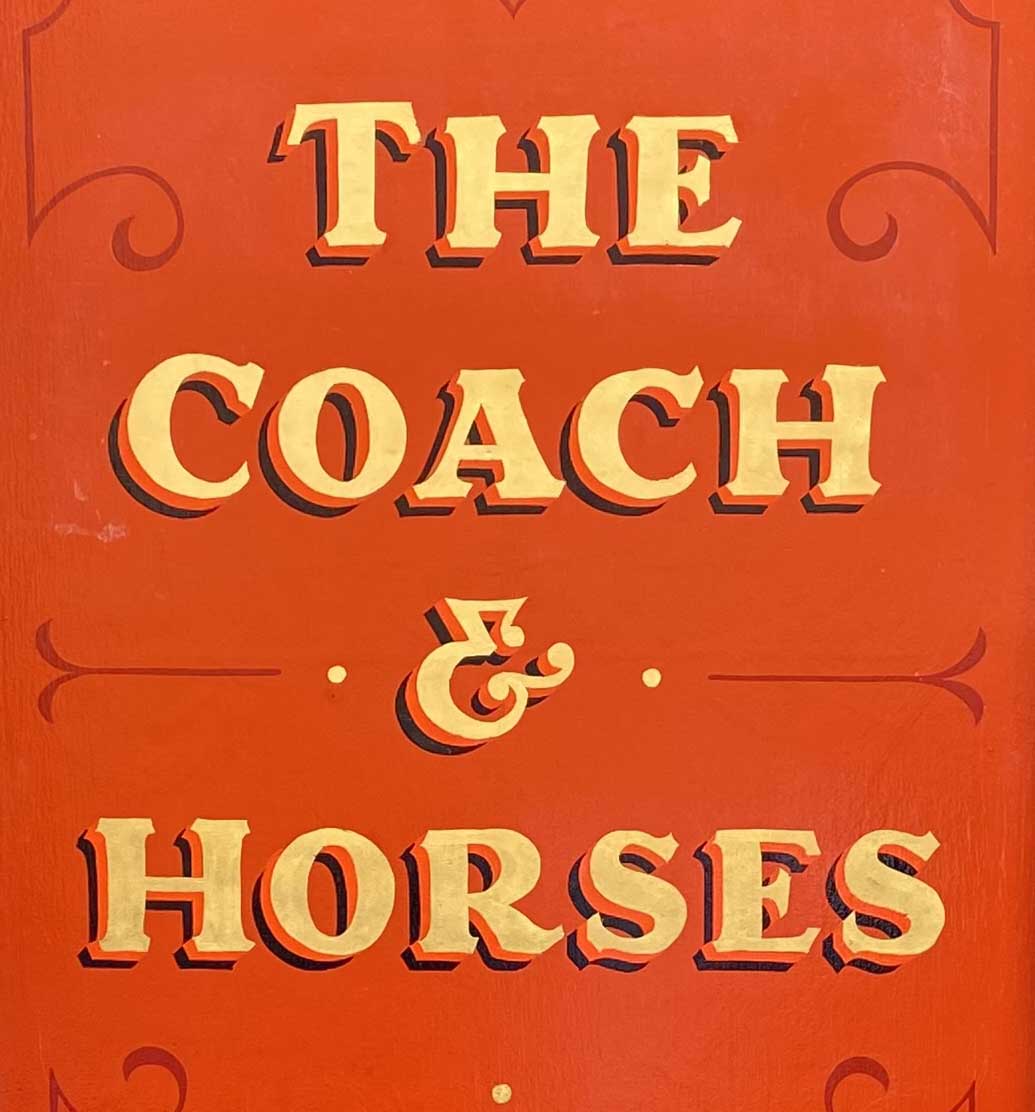 Sign at The Coach and Horses pub on Greek Street in London's Soho