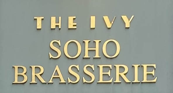 Sign at The Ivy restaurant on Broadwick Street in London's Soho