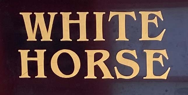 Sign at The White Horse pub on London's Newburgh Street