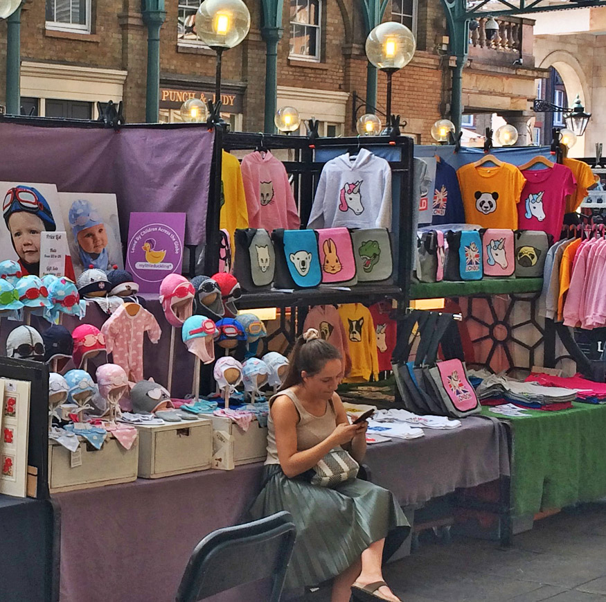 Childrenswear market stall at London's Covent Garden Market