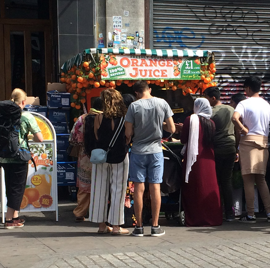 Orange juice stall near Camden Town station in London